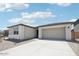 Charming home featuring a spacious driveway, perfect for parking, and a two-car garage at 2707 E Abe Truckle Ave, San Tan Valley, AZ 85140