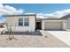 Inviting single-story home with a well-maintained front yard and attached two-car garage at 2707 E Abe Truckle Ave, San Tan Valley, AZ 85140