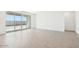 Bright living room with sliding glass doors to backyard and stylish, neutral tile flooring at 2707 E Abe Truckle Ave, San Tan Valley, AZ 85140