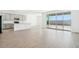Open-concept living room with tile flooring and sliding glass doors leading to the backyard at 2707 E Abe Truckle Ave, San Tan Valley, AZ 85140