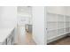 Walk-in pantry with ample shelving space for organized storage and easy access to the kitchen at 2707 E Abe Truckle Ave, San Tan Valley, AZ 85140