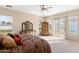 Bright bedroom with large windows, natural light, neutral colored walls, and plush carpeting at 2838 E Vaughn Ct, Gilbert, AZ 85234