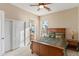 Well-lit bedroom featuring a double bed, natural lighting and a view of the adjacent bathroom at 2838 E Vaughn Ct, Gilbert, AZ 85234