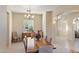 Formal dining room with a wooden table, seating for six, and ample light at 2838 E Vaughn Ct, Gilbert, AZ 85234