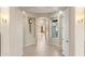 Hallway with tile floors, neutral walls, decorative lighting and arched entryways at 2838 E Vaughn Ct, Gilbert, AZ 85234