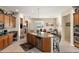 Kitchen with granite counters, an island with seating, and stainless-steel appliances at 2838 E Vaughn Ct, Gilbert, AZ 85234