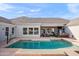 Backyard pool and covered patio offer a resort-like experience perfect for relaxing and entertaining in style at 2838 E Vaughn Ct, Gilbert, AZ 85234