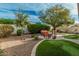 Picturesque backyard featuring outdoor seating, manicured landscaping, and a tranquil atmosphere, ideal for outdoor living at 3080 E Palmdale Ln, Gilbert, AZ 85298