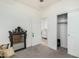 Neutral bedroom with gray carpet, featuring a closet with sliding doors and a decorative mirror, providing a calm and relaxing space at 3080 E Palmdale Ln, Gilbert, AZ 85298