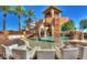 Resort-style pool area with unique architectural features, water slides, and comfortable seating at 3080 E Palmdale Ln, Gilbert, AZ 85298