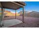 Spacious backyard featuring a covered patio and low-maintenance rock landscaping at 3225 W Fremont Rd, Phoenix, AZ 85041