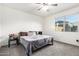 Bedroom with neutral walls, carpet flooring, and a window with a view of the outside at 3225 W Fremont Rd, Phoenix, AZ 85041