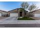 Charming single-story home with a well-manicured lawn, a two-car garage, and desert landscaping at 3225 W Fremont Rd, Phoenix, AZ 85041