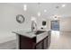 A kitchen island featuring granite countertops, stainless steel sink, and pendant lighting at 3225 W Fremont Rd, Phoenix, AZ 85041