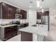 Modern kitchen featuring granite countertops, stainless steel appliances, and a large island sink at 3225 W Fremont Rd, Phoenix, AZ 85041