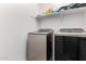 Clean laundry room features modern washer and dryer set, shelf for storage at 3225 W Fremont Rd, Phoenix, AZ 85041