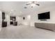 Open-concept living room and kitchen with tile flooring and modern gray cabinets for storage at 3225 W Fremont Rd, Phoenix, AZ 85041