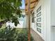 Charming home features outdoor shower and modern glass door, surrounded by lush landscaping at 3424 N 36Th St, Phoenix, AZ 85018