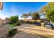 Backyard featuring a seating area with mature landscaping at 398 W Honey Locust Ave, San Tan Valley, AZ 85140