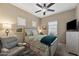 Bedroom with ceiling fan and bed frame with drawers at 398 W Honey Locust Ave, San Tan Valley, AZ 85140