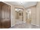 Inviting foyer with tile flooring, showcasing arches leading to the living areas and bedrooms at 398 W Honey Locust Ave, San Tan Valley, AZ 85140