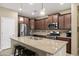 Modern kitchen featuring a large island, stainless steel appliances, and ample cabinet space at 398 W Honey Locust Ave, San Tan Valley, AZ 85140