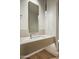 Modern powder room with a sleek floating vanity, pendant lighting, and minimalist design at 5000 N Camelback Ridge Rd # 410, Scottsdale, AZ 85251