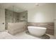 Contemporary bathroom with a freestanding tub, glass shower, and modern fixtures at 5000 N Camelback Ridge Rd # 410, Scottsdale, AZ 85251