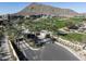 Scenic view of the Ascent community entrance featuring lush landscaping and a picturesque golf course backdrop at 5000 N Camelback Ridge Rd # 410, Scottsdale, AZ 85251