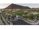 Scenic Ascent at the Scottsdale community entrance with lush landscaping, golf course, and mountain views at 5000 N Camelback Ridge Rd # 410, Scottsdale, AZ 85251