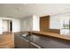 Kitchen island with a sleek design and modern faucet fixtures, hardwood floors, and an open design at 5000 N Camelback Ridge Rd # 410, Scottsdale, AZ 85251