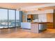 Modern kitchen featuring stainless steel appliances, light wood floors, and plenty of natural light from a large window at 5000 N Camelback Ridge Rd # 410, Scottsdale, AZ 85251