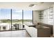 Kitchen with a large window offering city views, a sleek island, and modern minimalist design at 5000 N Camelback Ridge Rd # 410, Scottsdale, AZ 85251