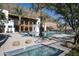 Beautiful pool area with lush palm trees and modern architecture, offering a serene and luxurious outdoor retreat at 5000 N Camelback Ridge Rd # 410, Scottsdale, AZ 85251