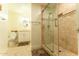 Modern bathroom featuring a glass-enclosed shower with custom tile and updated fixtures and vanity at 508 W Harmont Dr, Phoenix, AZ 85021