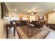 Expansive living room with tiled floors, a ceiling fan, and an open floor plan connected to the kitchen at 508 W Harmont Dr, Phoenix, AZ 85021