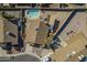 Overhead view showcasing a backyard featuring a private swimming pool, patio area, and mature landscaping at 6433 W Beverly Ln, Glendale, AZ 85306