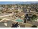 An aerial shot highlighting a private backyard with a refreshing swimming pool and patio area at 6433 W Beverly Ln, Glendale, AZ 85306