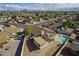 A high-angle shot featuring a backyard oasis with a sparkling pool and an outdoor living space at 6433 W Beverly Ln, Glendale, AZ 85306