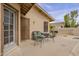 Charming back patio area with comfortable seating, ideal for relaxing and outdoor entertainment at 6433 W Beverly Ln, Glendale, AZ 85306