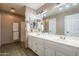 Bathroom features a double sink vanity, tile floors, and a shower/tub combo at 6433 W Beverly Ln, Glendale, AZ 85306