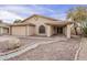 Beautiful single-story home with desert landscaping, rock yard and attached garage at 6433 W Beverly Ln, Glendale, AZ 85306