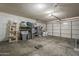 Spacious garage with concrete floors and ample storage space, providing room for vehicles and organization at 6433 W Beverly Ln, Glendale, AZ 85306