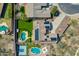 A birds eye view of a home with solar panels, pool, and a sport court at 6603 W Via Dona Rd, Phoenix, AZ 85083