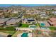 A high angle view of home with a sport court, pools and desert landscape at 6603 W Via Dona Rd, Phoenix, AZ 85083