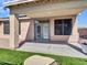 Back patio with pavers and artificial turf with covered seating area at 6603 W Via Dona Rd, Phoenix, AZ 85083