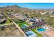 Aerial view of a home's backyard with a pool, sport court, and landscaped yard at 6603 W Via Dona Rd, Phoenix, AZ 85083