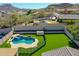 An aerial view of an enclosed yard with a pool and spa at 6603 W Via Dona Rd, Phoenix, AZ 85083