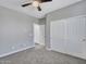 Bedroom featuring neutral carpet and paint with a large closet at 6603 W Via Dona Rd, Phoenix, AZ 85083