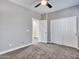 Bedroom featuring neutral carpet and paint with access to a walk-in closet at 6603 W Via Dona Rd, Phoenix, AZ 85083